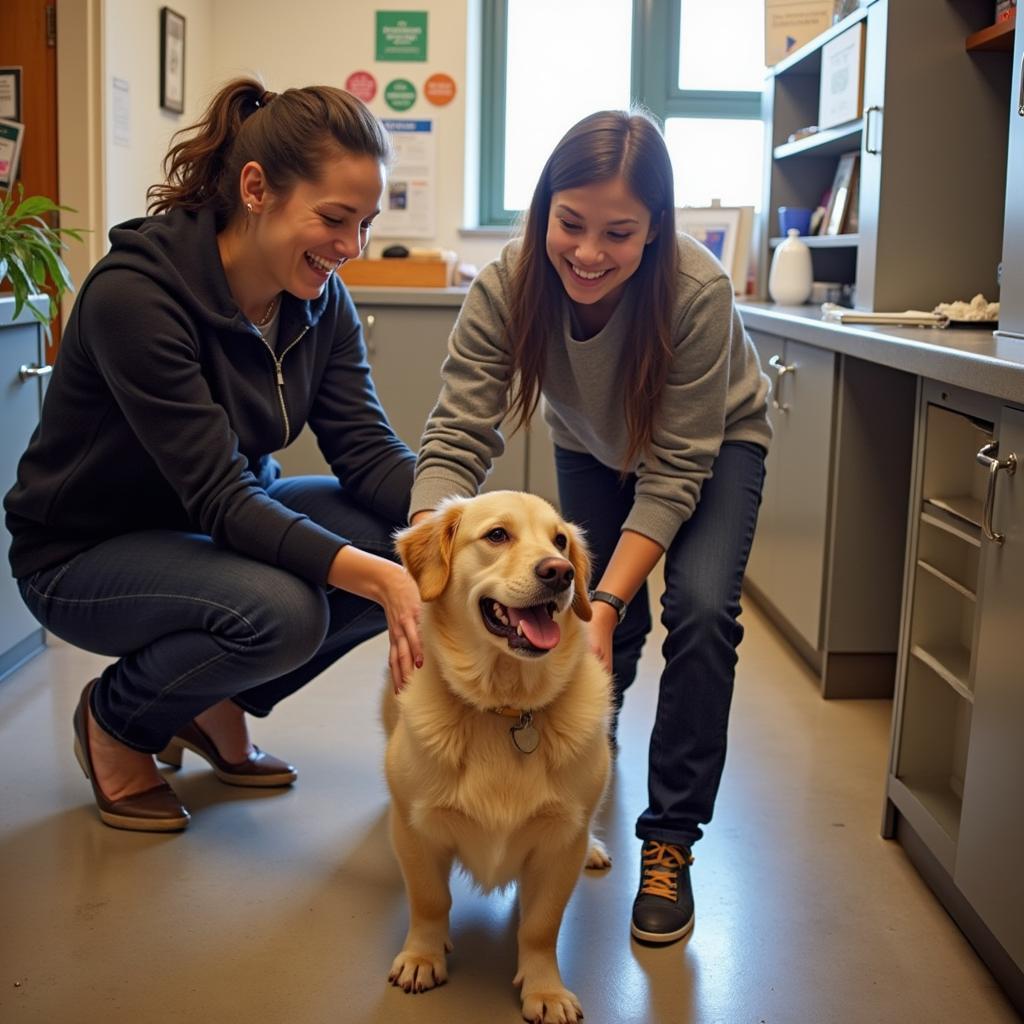 Happy family adopting a dog at the Chautauqua County Humane Society