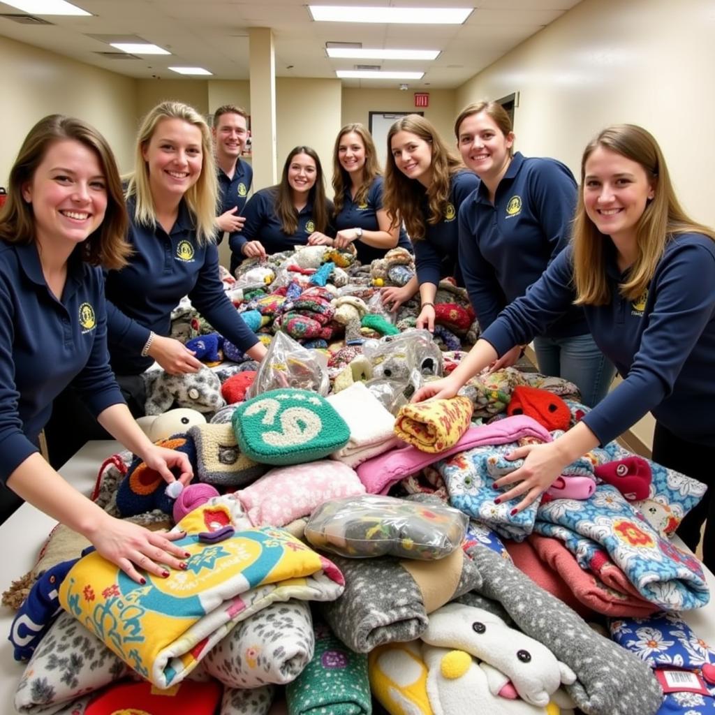 Volunteers organize donated items during a successful donation drive at the Crawford County Humane Society, demonstrating community support for animal welfare.