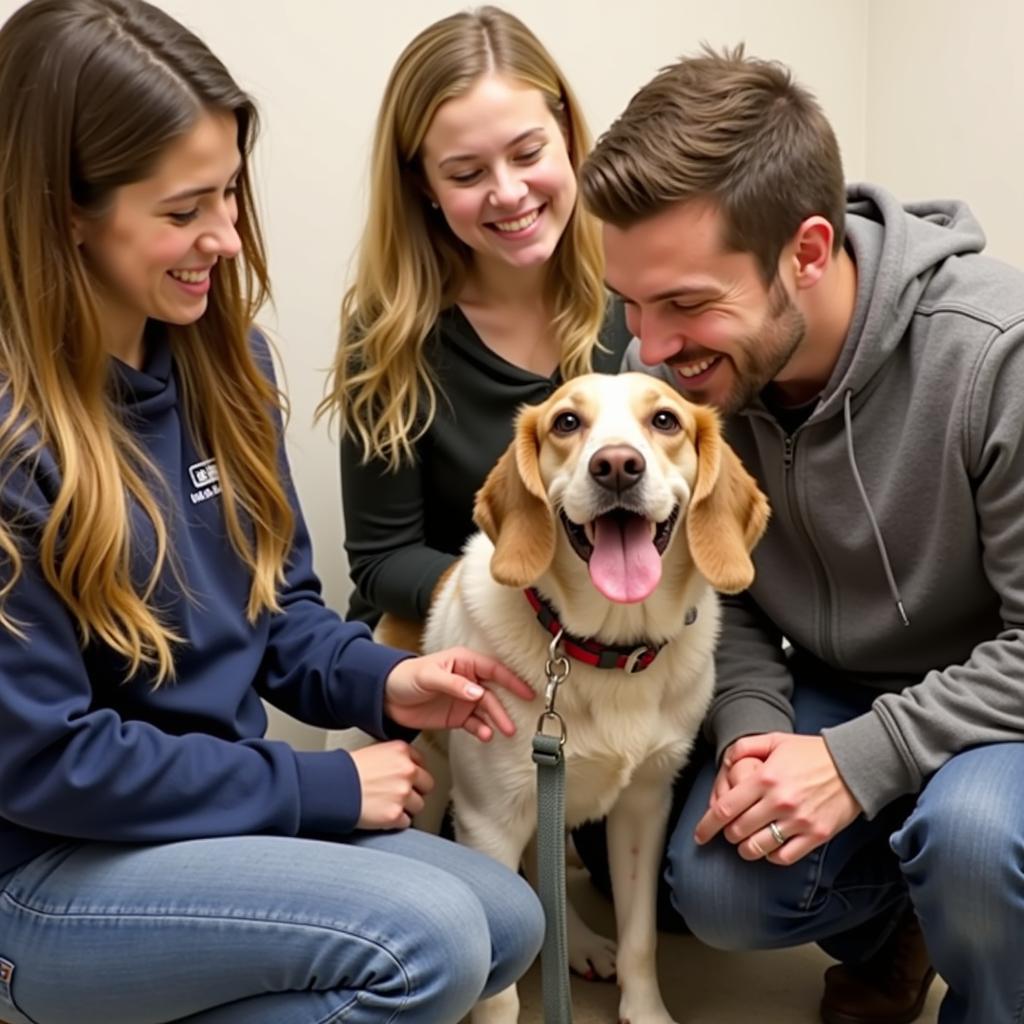 A happy family meeting a dog at the Women's Humane Society Bensalem