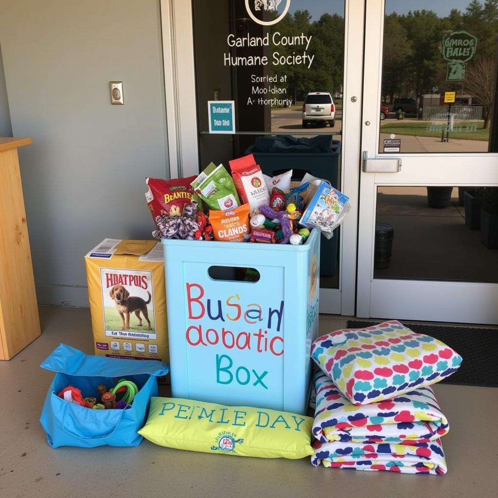 A donation box overflows with pet supplies, showcasing the generosity of the local community towards the Garland County Humane Society