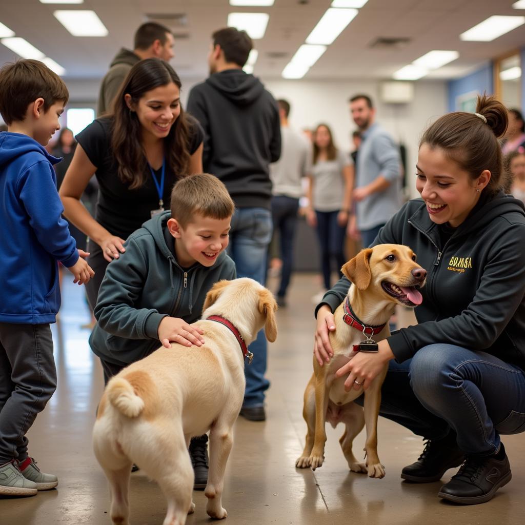 Families interacting with adoptable pets at a Circle of Friends Humane Society event.