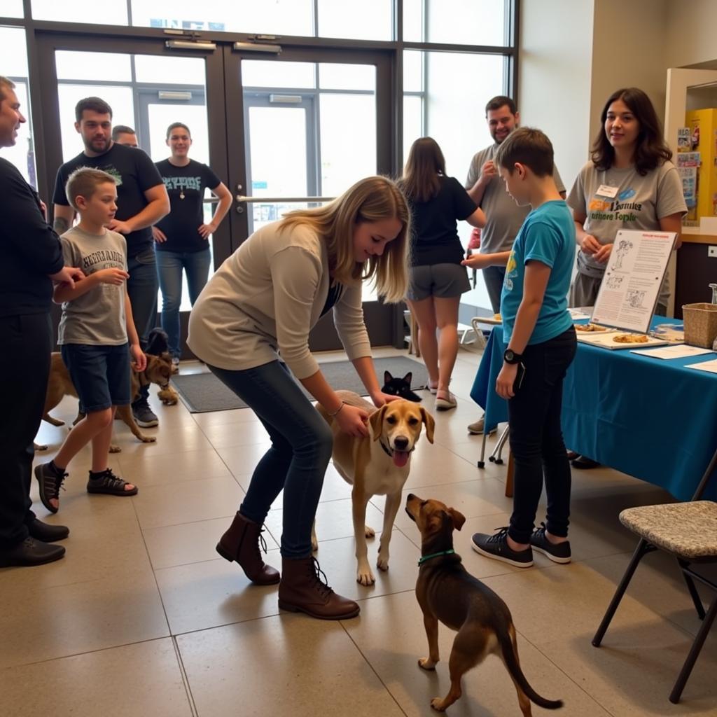 Families interacting with adoptable pets at a Grand Strand Humane Society adoption event