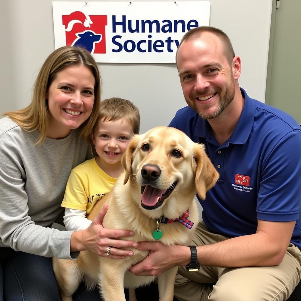 A family smiles with joy as they adopt a dog at the Humane Society of Pittsburgh North Side.