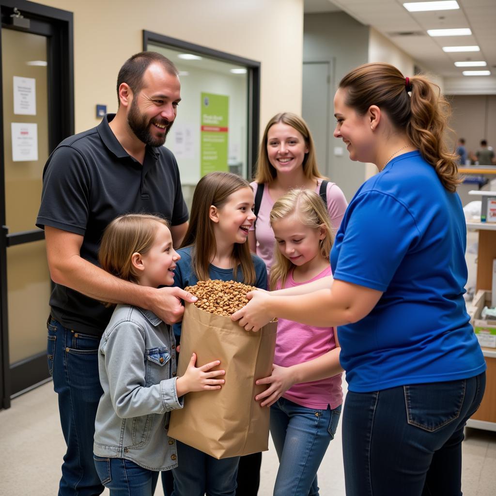 A family receives pet food assistance at the Humane Society of St. Clair County