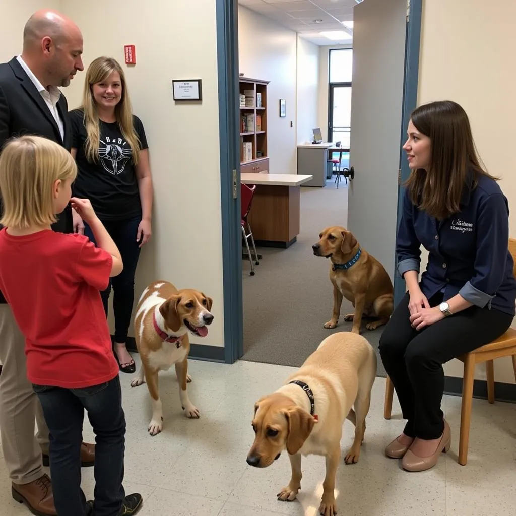 A compassionate adoption counselor assisting a family in choosing the right pet.