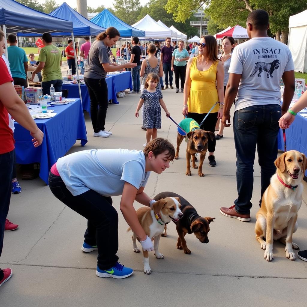 Families and their pets gather at a Humane Society Middlebury community event