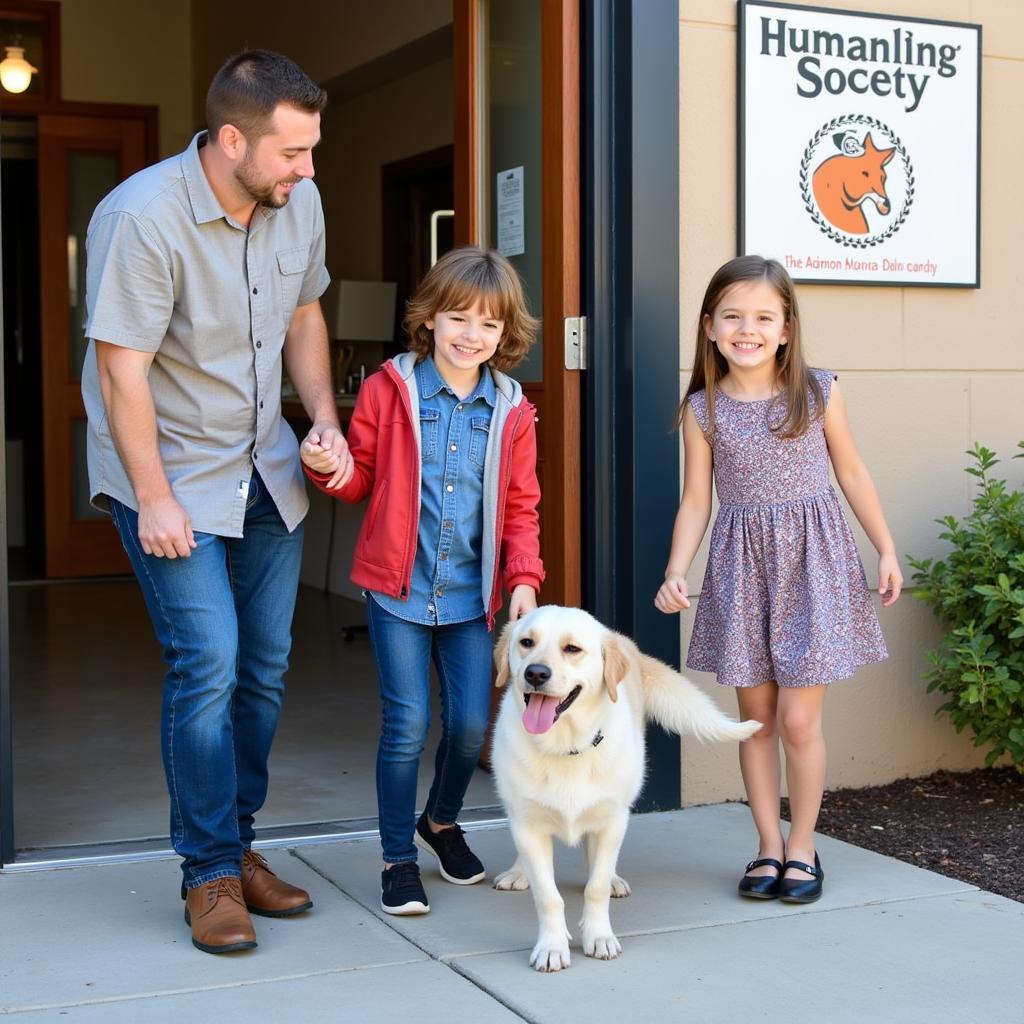 A happy family welcomes their new furry friend home from the Humane Society San Mateo