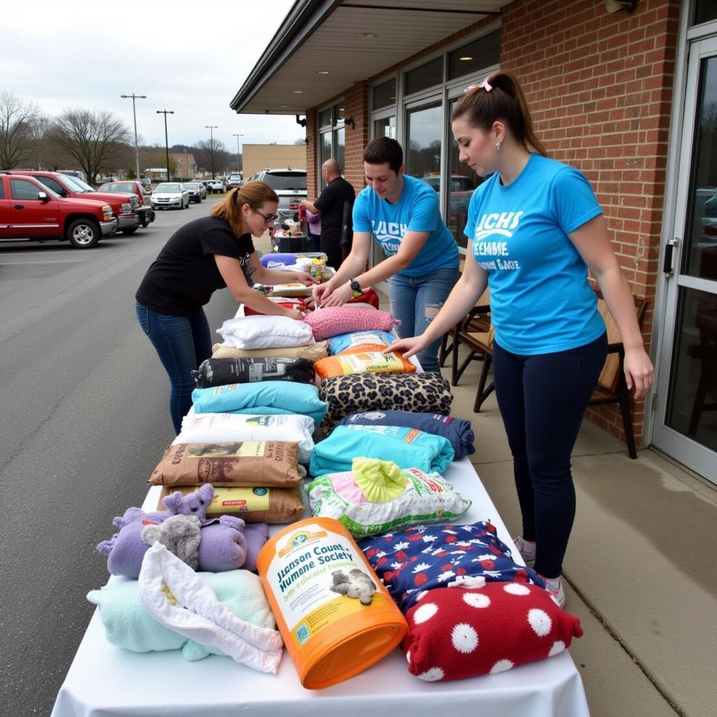 Community members donating supplies at a Jackson County Humane Society donation drive