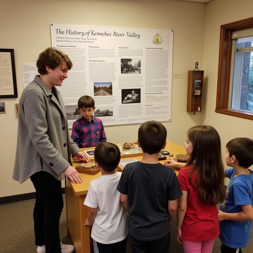 Kennebec Historical Society Exhibit: Visitors engage with an interactive exhibit at the Kennebec Historical Society.