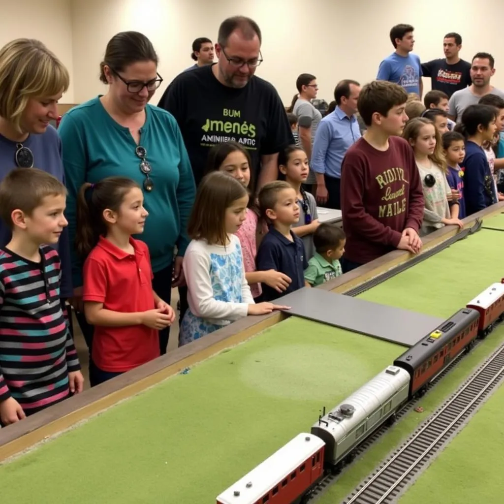 Visitors, including families and children, exploring the LAMRS layout during an open house event