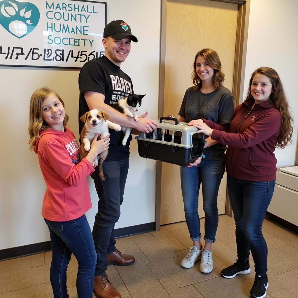 A Happy Family Adopts a Cat at Marshall County Humane Society