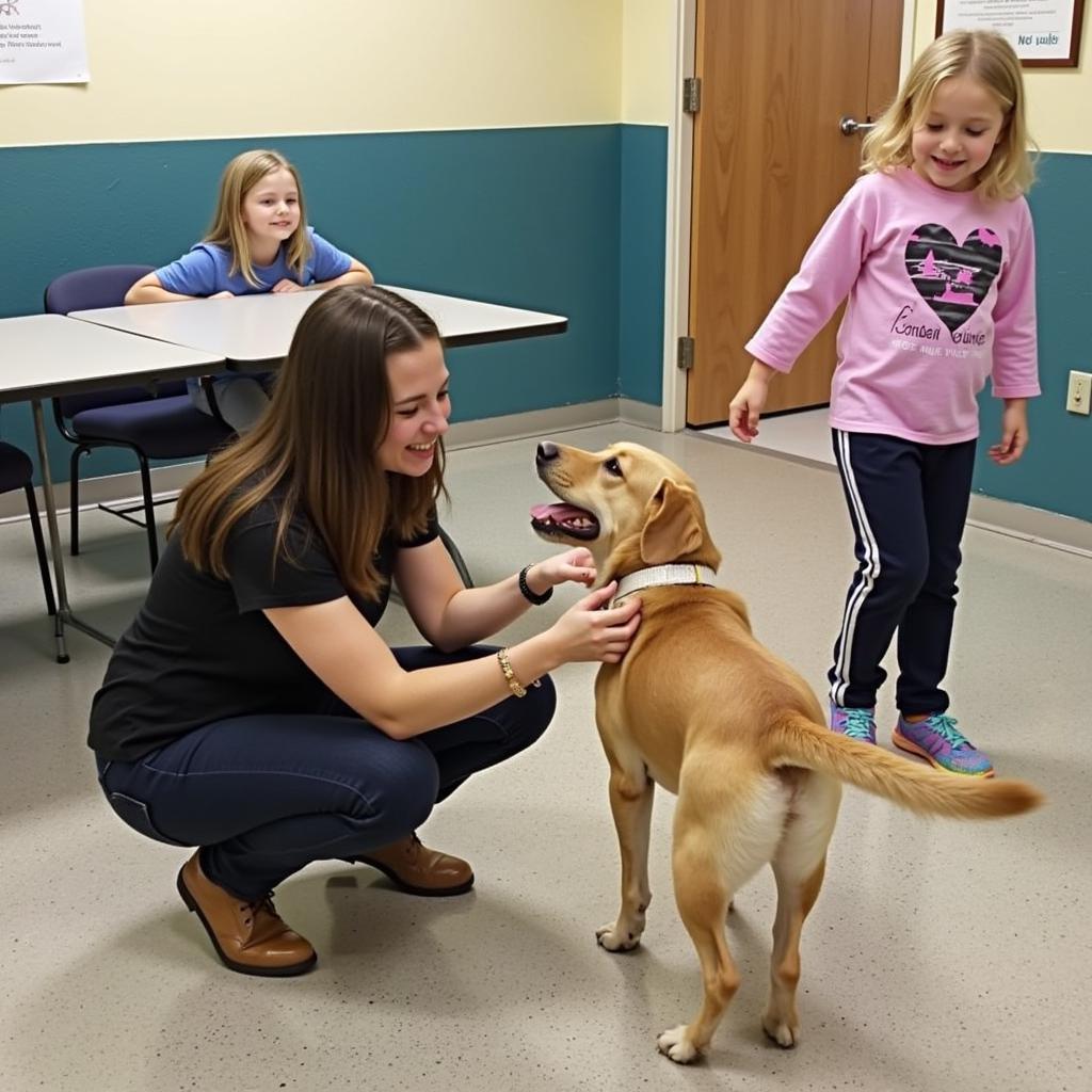 A family meeting a dog at the McCracken County Humane Society