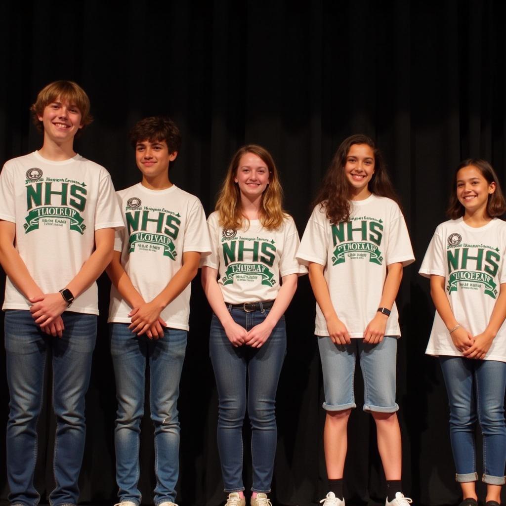 NJHS students wearing matching shirts at an induction ceremony