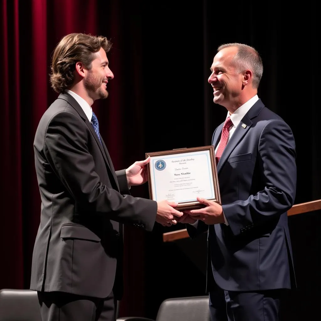 An NSHSS member receiving an award at a recognition ceremony.