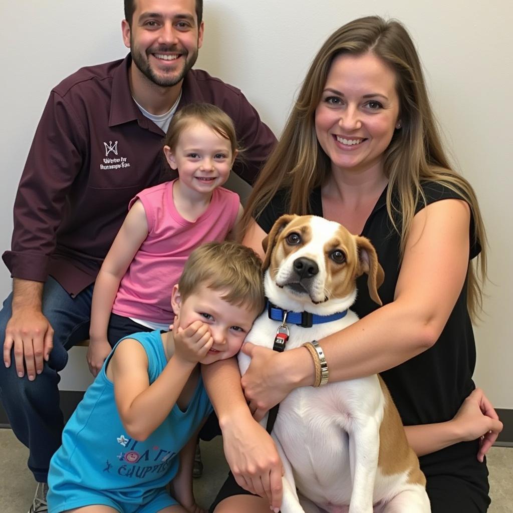  A happy family poses with their newly adopted dog at the Warren County VA Humane Society