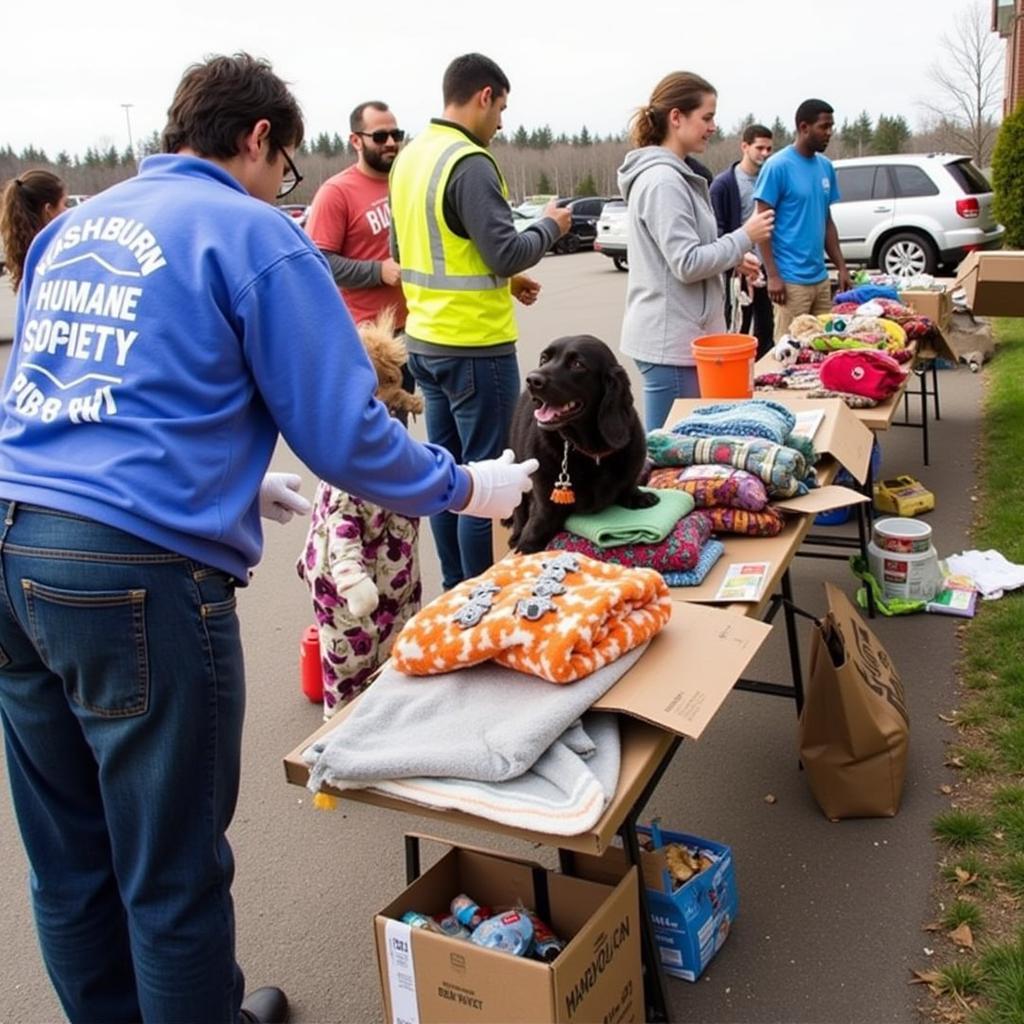 Community members participating in a donation drive for the Washburn Humane Society