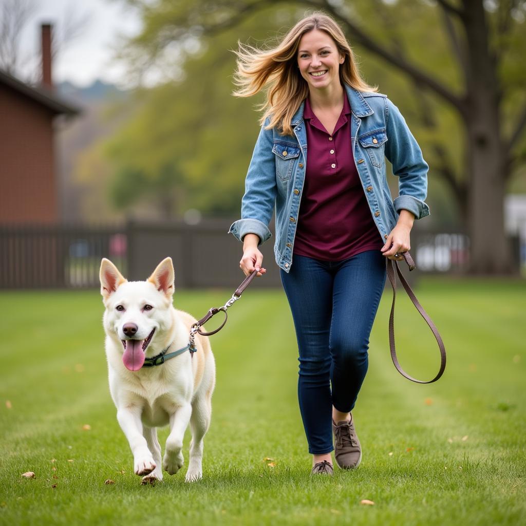 Volunteer Walking Dog at Young County Humane Society