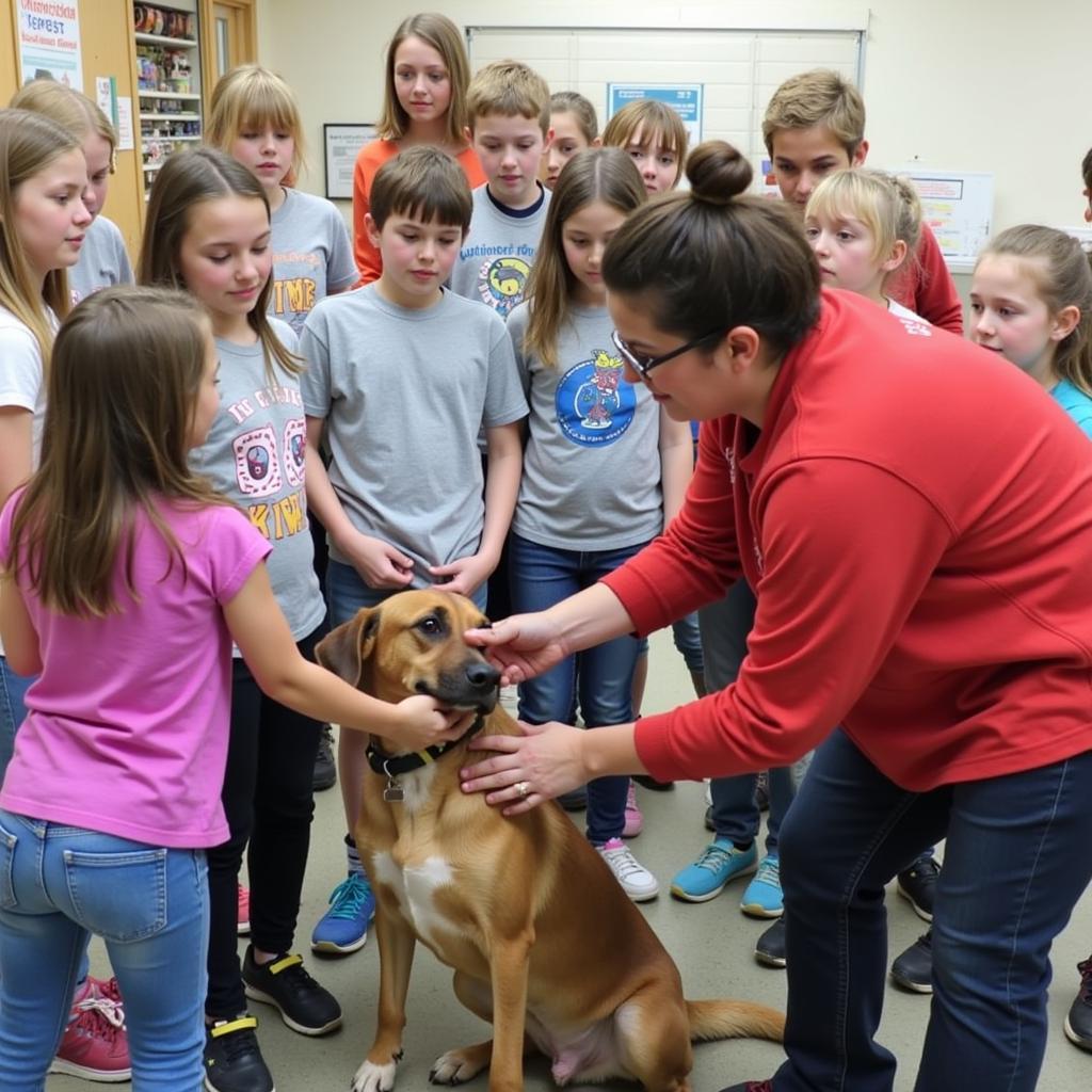 Cass County Humane Society volunteers educating children about animal care.