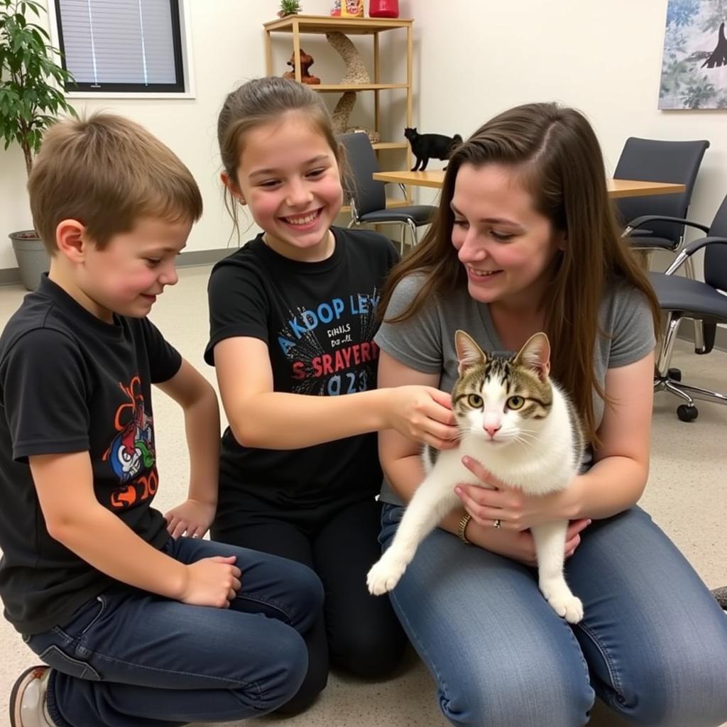 A happy family adopting a cat at the Collin County Humane Society McKinney