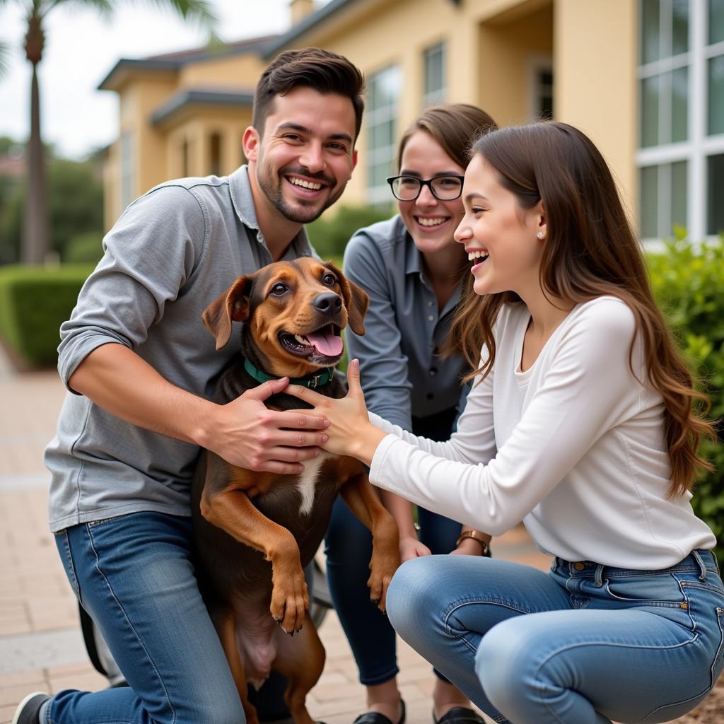 A family adopting a pet at a Daytona Humane Society adoption event