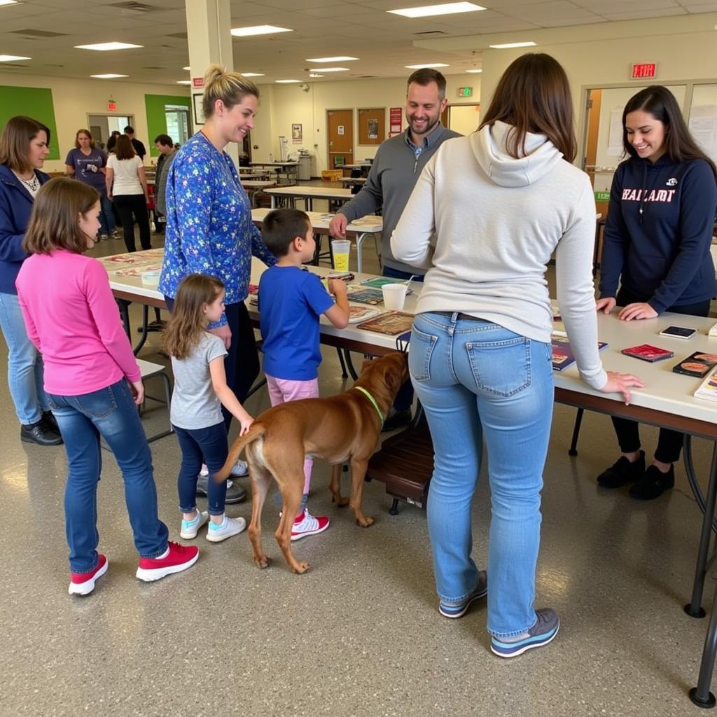 Families finding their new furry friends at a Dyersburg Dyer County Humane Society adoption event.