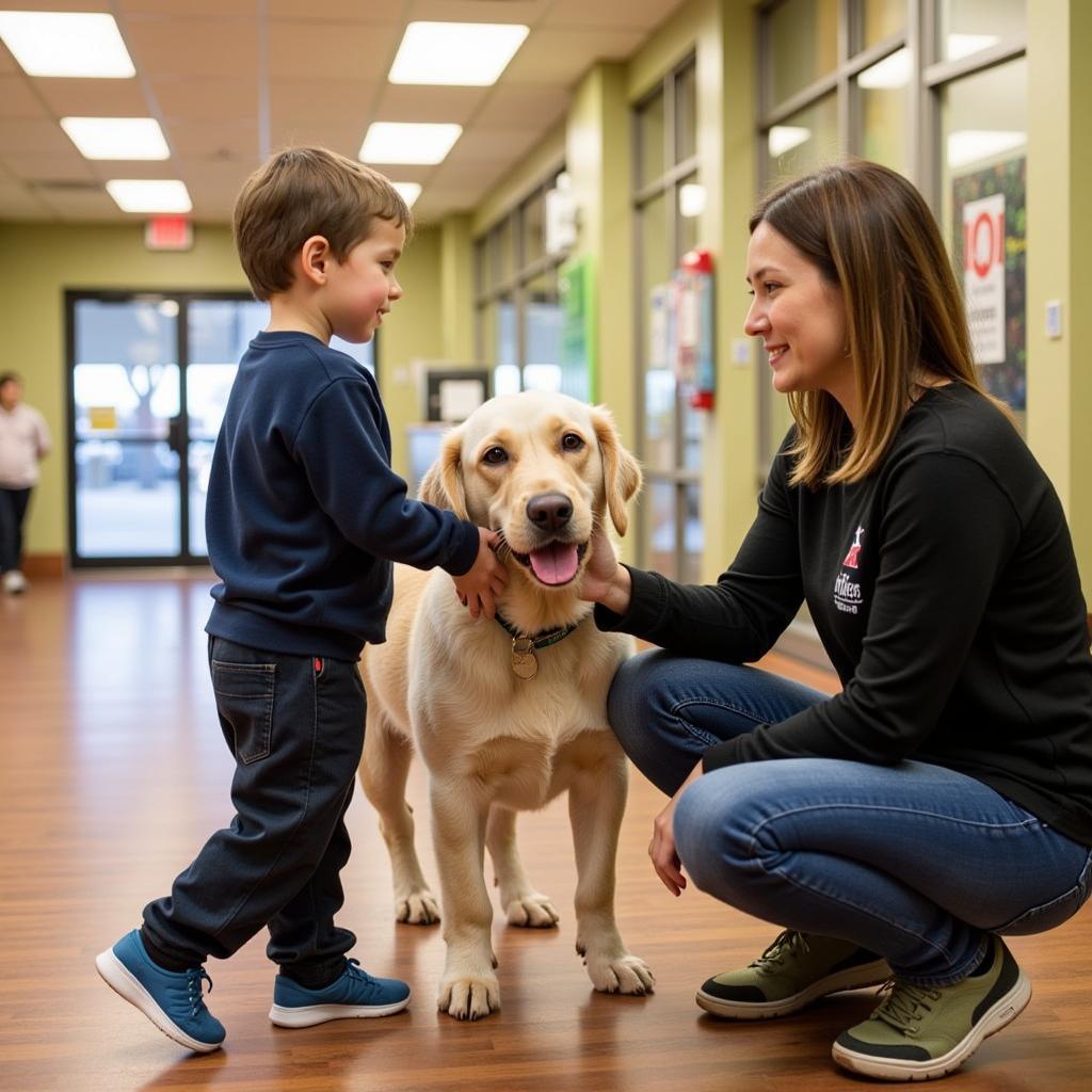 Oregon Humane Society Adoption Counselor Helping Family Choose a Pet