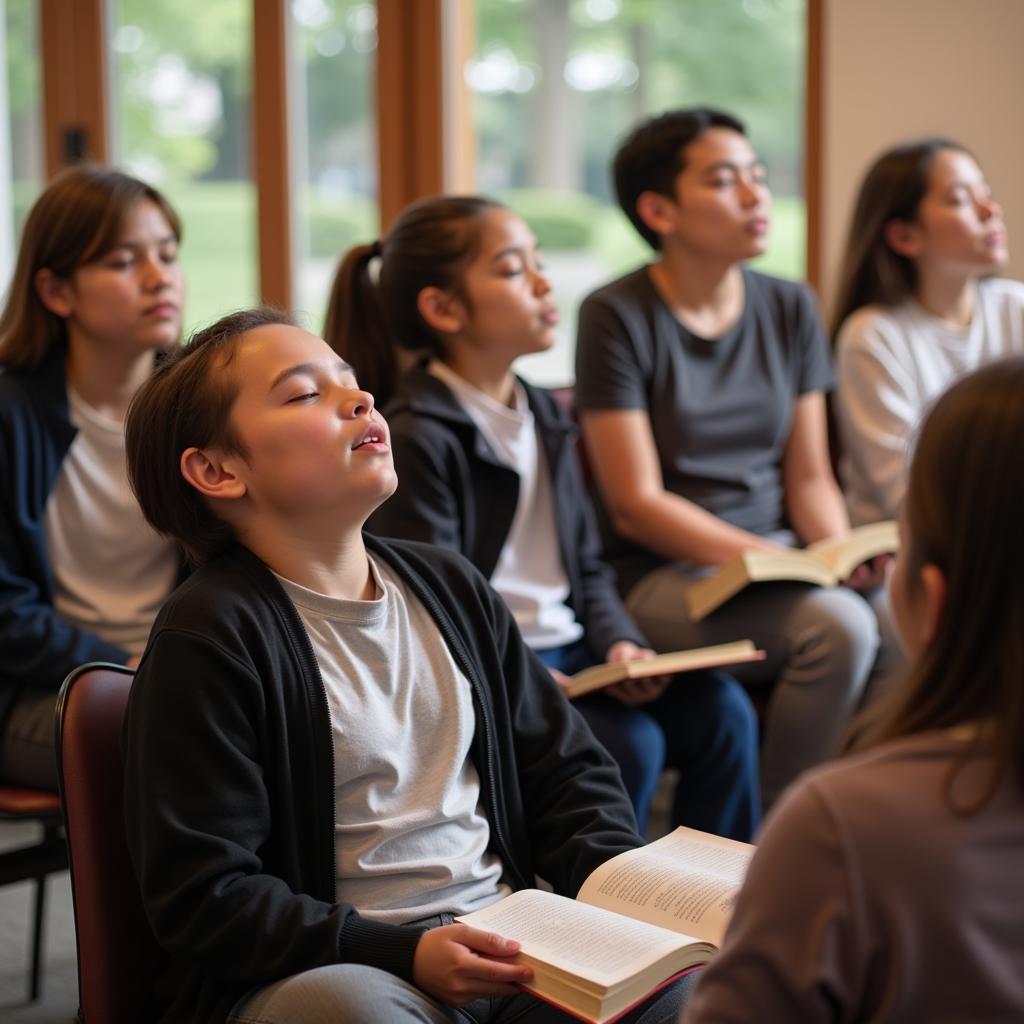 Students practicing relaxation techniques during an anti-test anxiety society read-aloud session