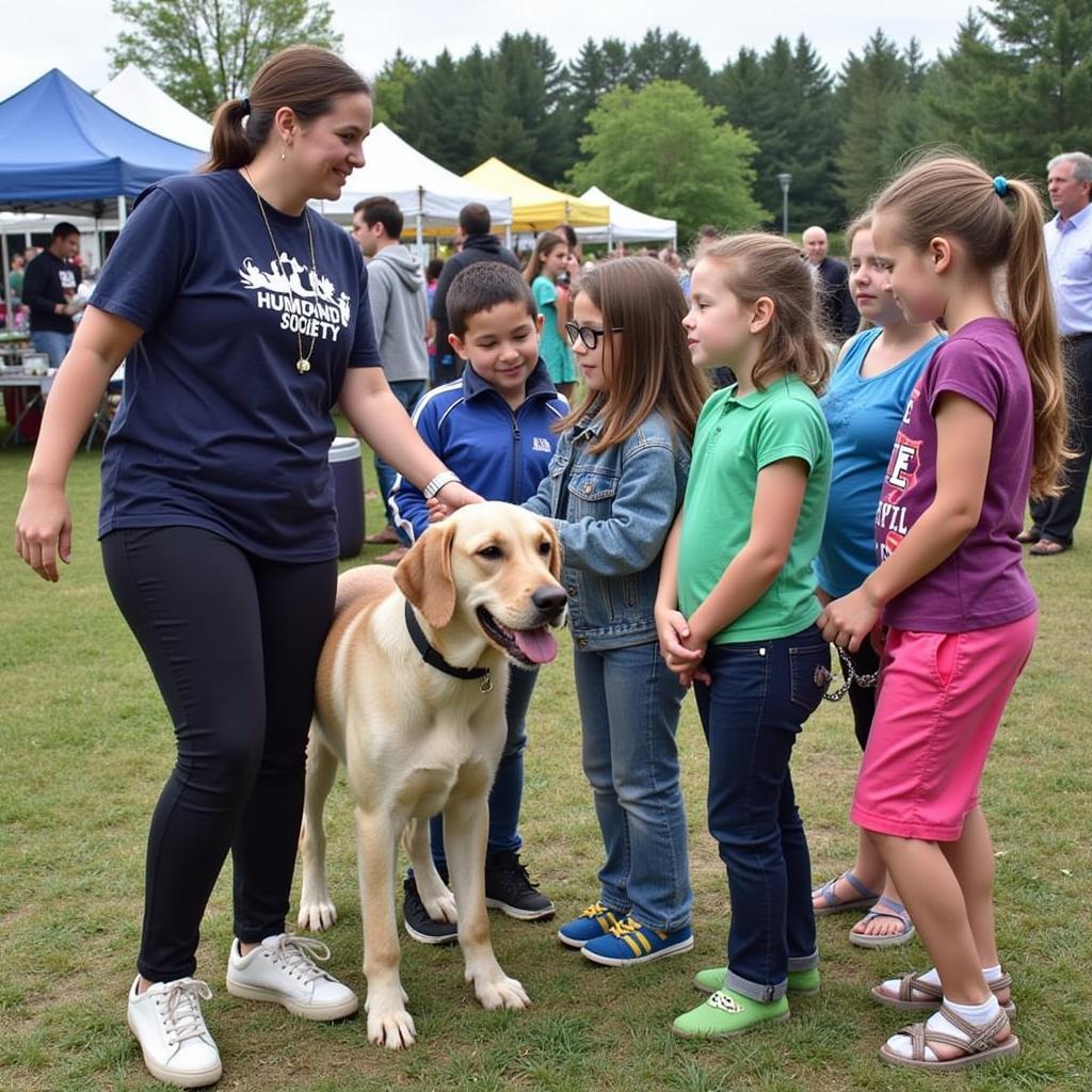 Swanzey Humane Society staff engaging with the community through educational outreach.