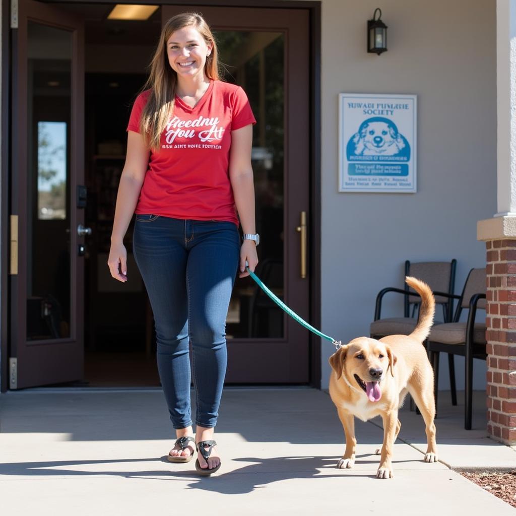 Happy Adopter at Yavapai Humane Society: A new pet owner is happily leaving the Yavapai Humane Society on Sundog Ranch Road in Prescott, AZ, with their newly adopted pet. 