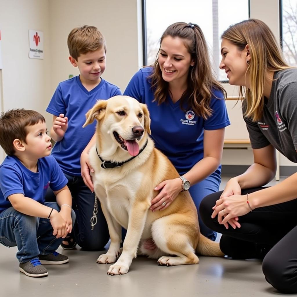 A family meeting a dog at a humane society.