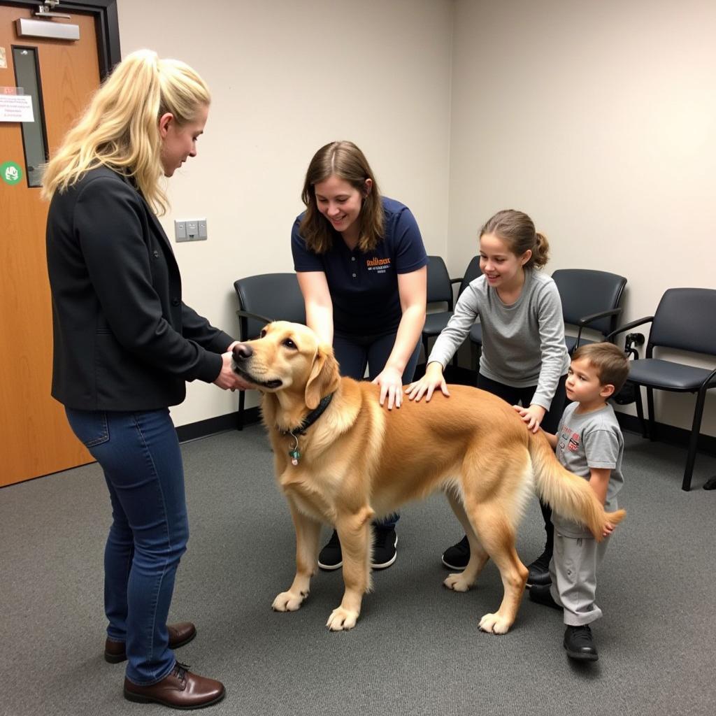 A family meeting a dog at the Putnam County Humane Society