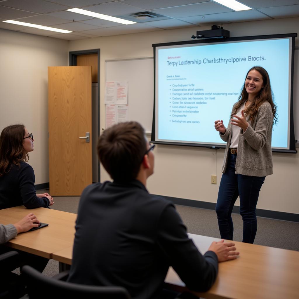 A student giving a presentation to a group of peers.