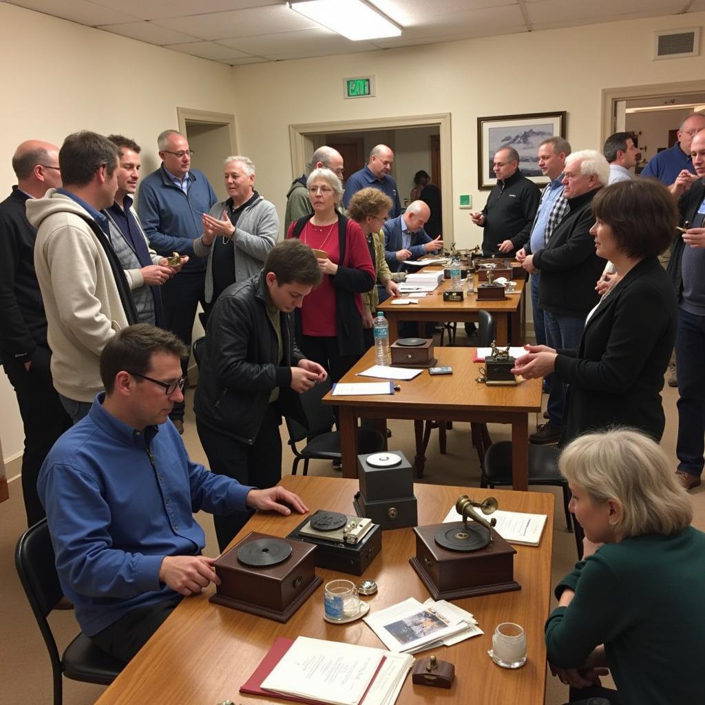 Members of an antique phonograph society gathered at a meeting