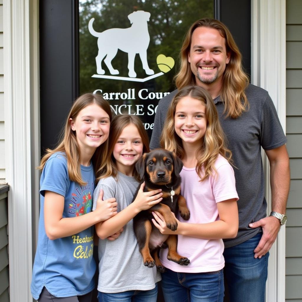 Family with their newly adopted puppy from Carroll County Humane Society