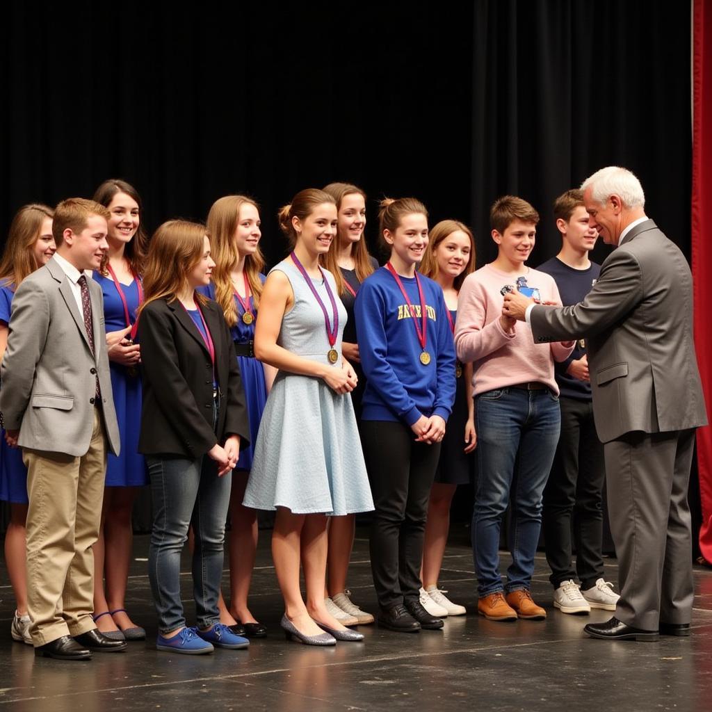 Students receiving their NHS pins at an induction ceremony.